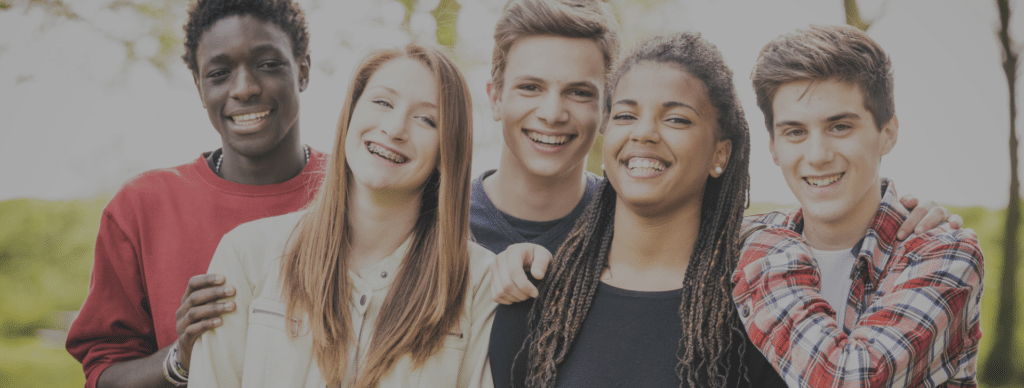 group of friends smiling for a photo