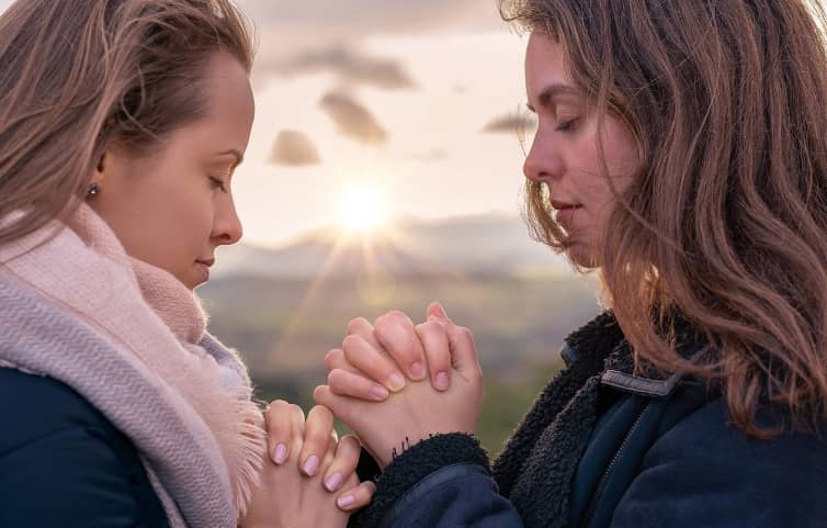 two women praying