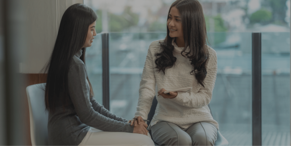 therapist comforting her client while talking