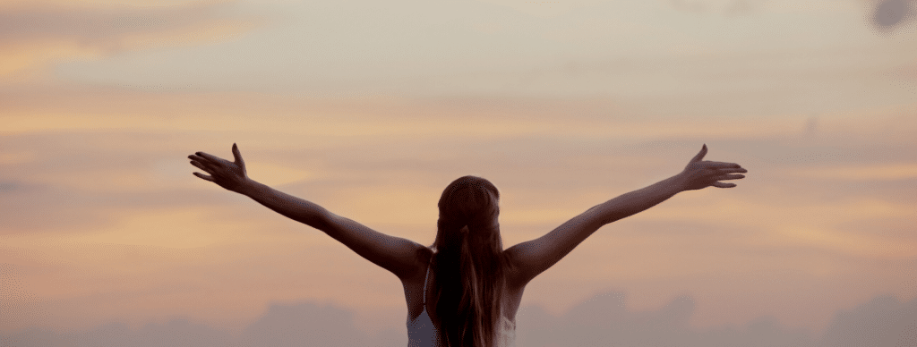 woman holding arms outstretched