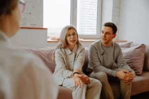 couple sitting in therapy talking about their relationship