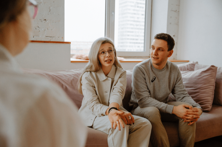 couple sitting in therapy talking about their relationship