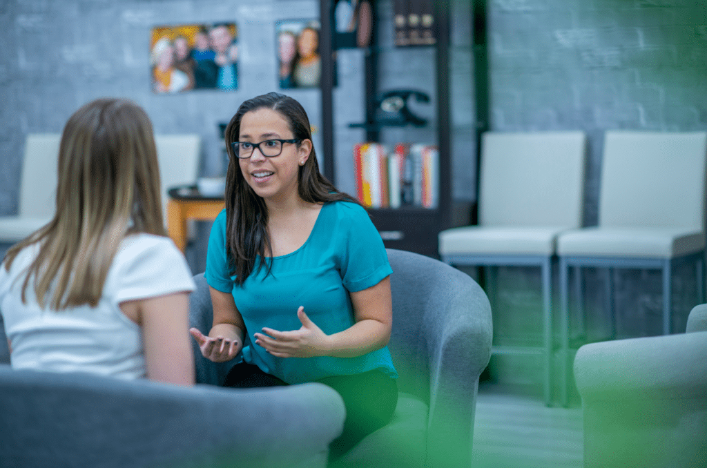 therapist talking to a client in an office space