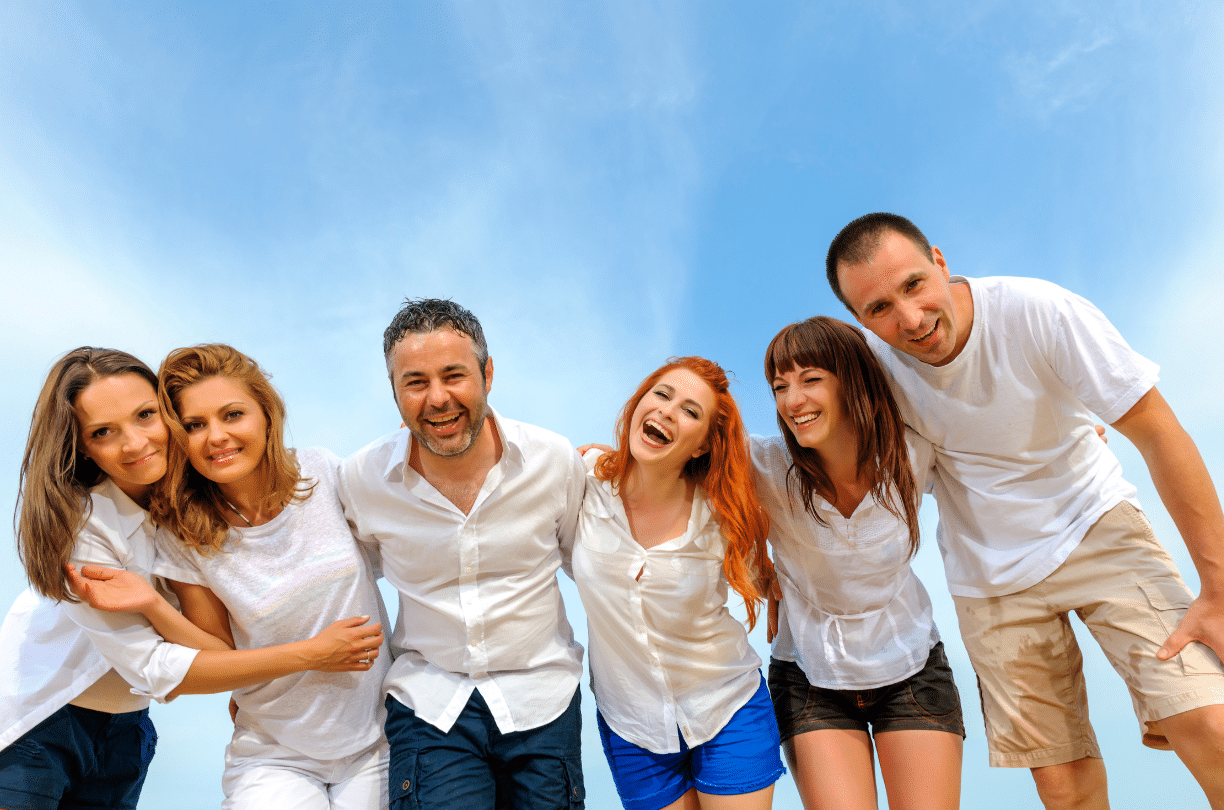 group of friends smiling outside