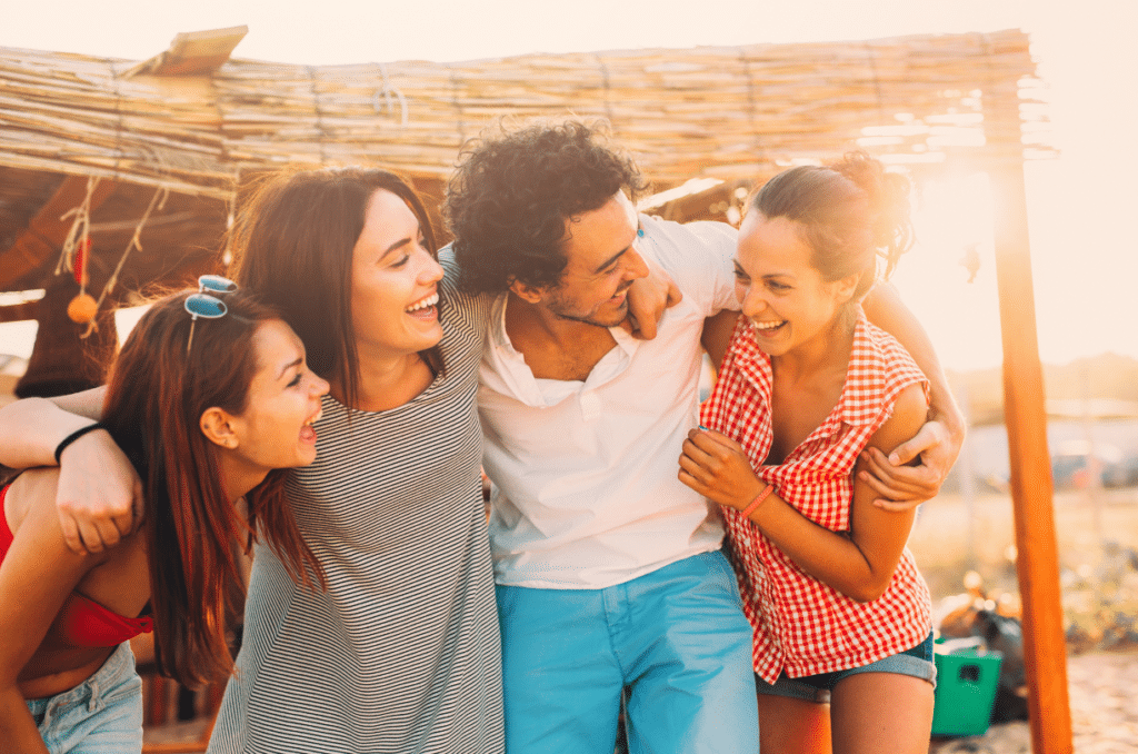 group of friends hugging and laughing