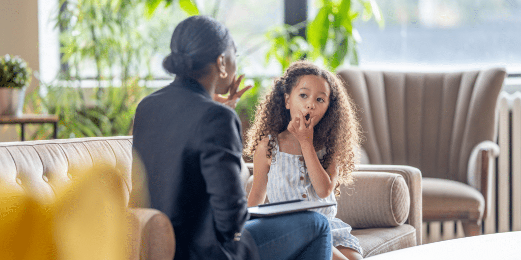 child with a therapist in an open setting