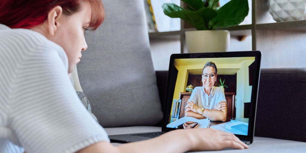 client on a virtual call with her therapist