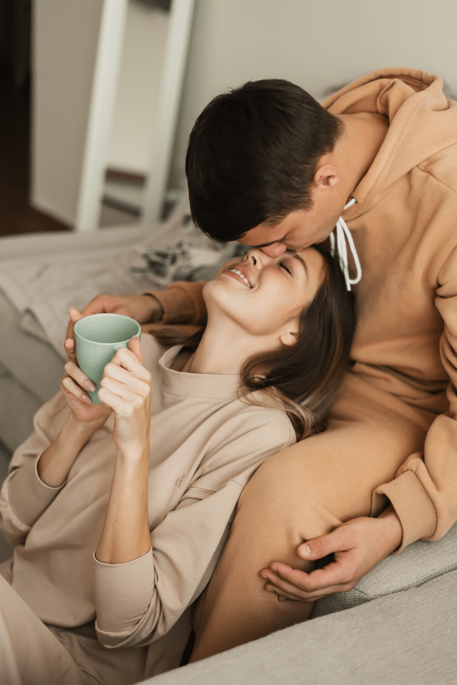 happy couple loving on each other on couch