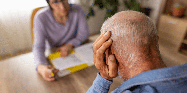 older man talking to a therapist