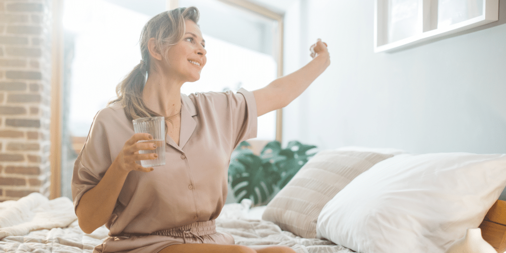 woman feeling refreshed waking out of bed