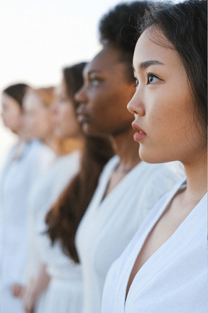 women of diversity standing in a line looking forward