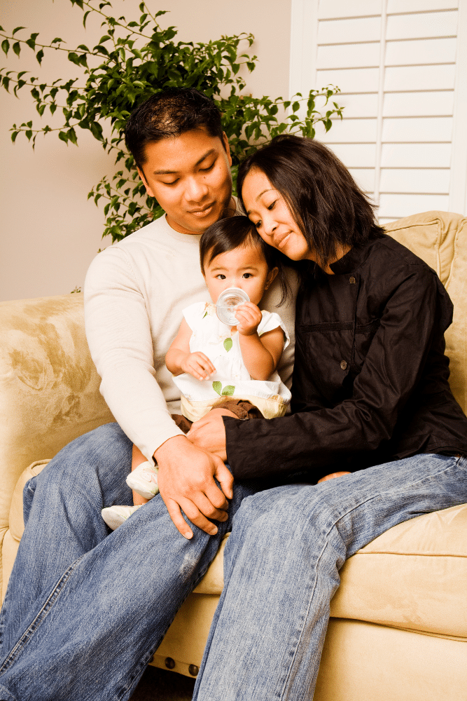 asian family hugging their baby in therapy, asian american therapy