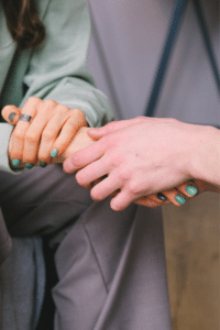 man and a woman holding hands together