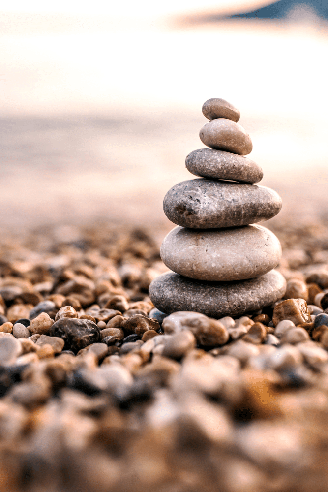 rocks stacked on top of each other on a beach