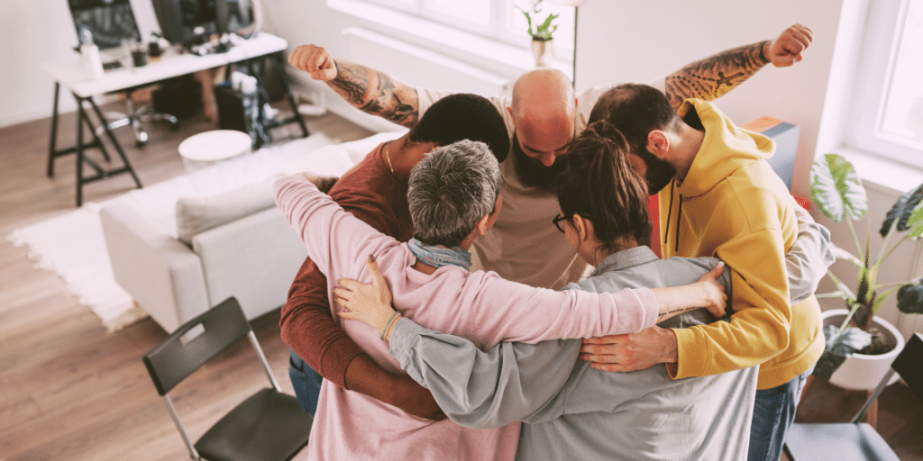 group therapy session, clients hugging