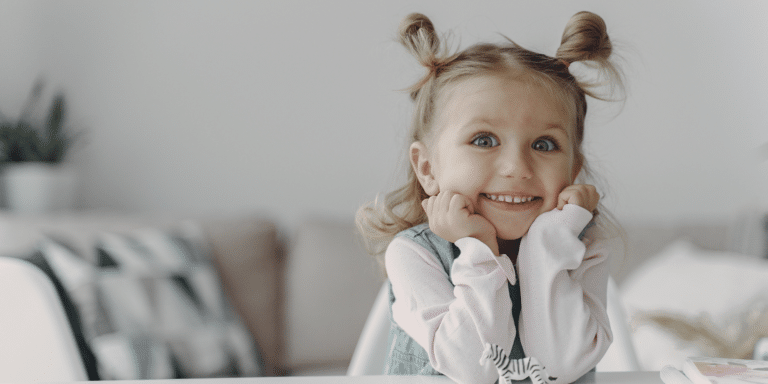 little girl smiling in her therapy room