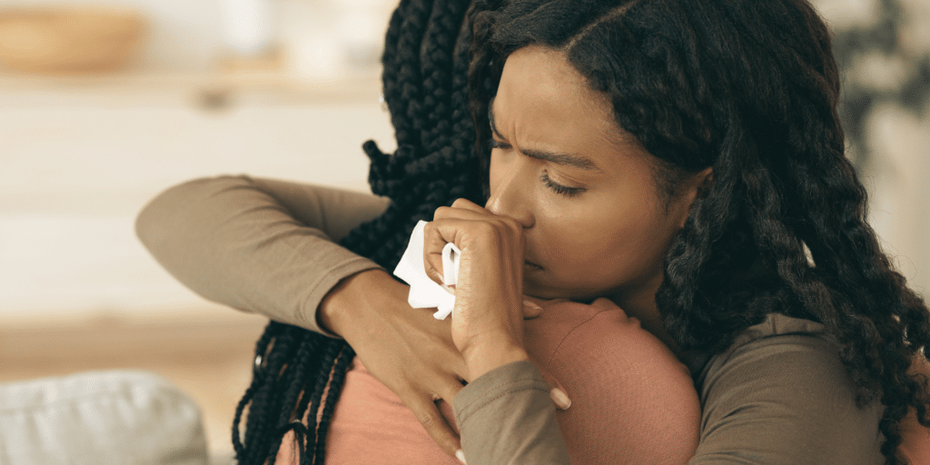 lady client hugging her counselor after crying