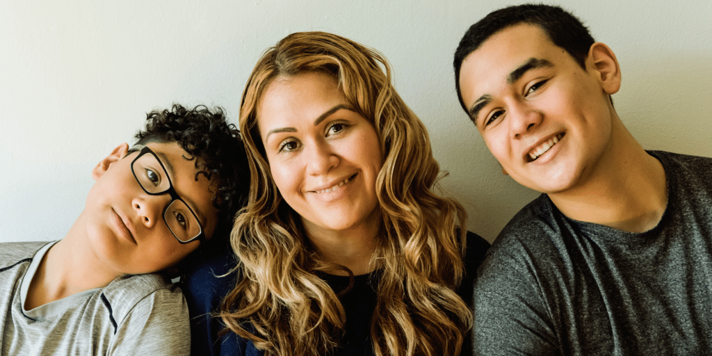 mom and her two sons smiling and looking forward, joy from therapy