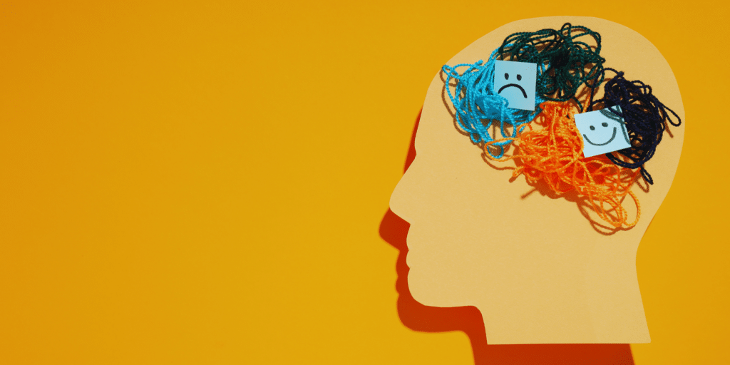 symbolism of a brain thinking about a bunch of different happy and sad emotions