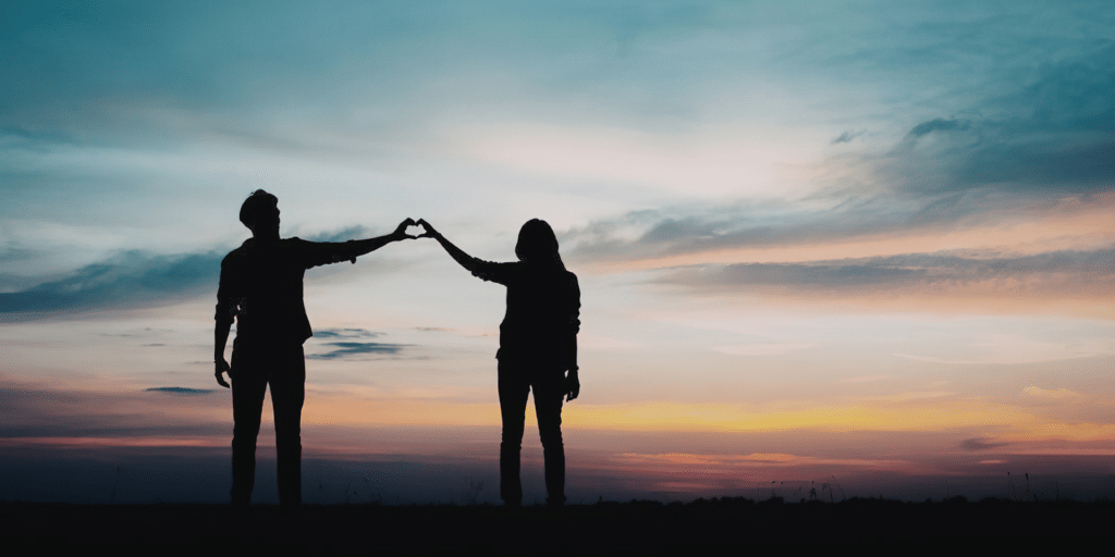 Couple holding hands after a successful couples therapy session in Denver