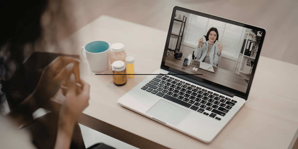 Online therapy video call session on a laptop with a Denver therapist