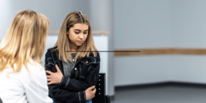 Teen girl in therapy counseling session for adolescent mental health in Denver