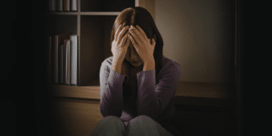 Woman processing emotions during a therapy counseling session in Denver