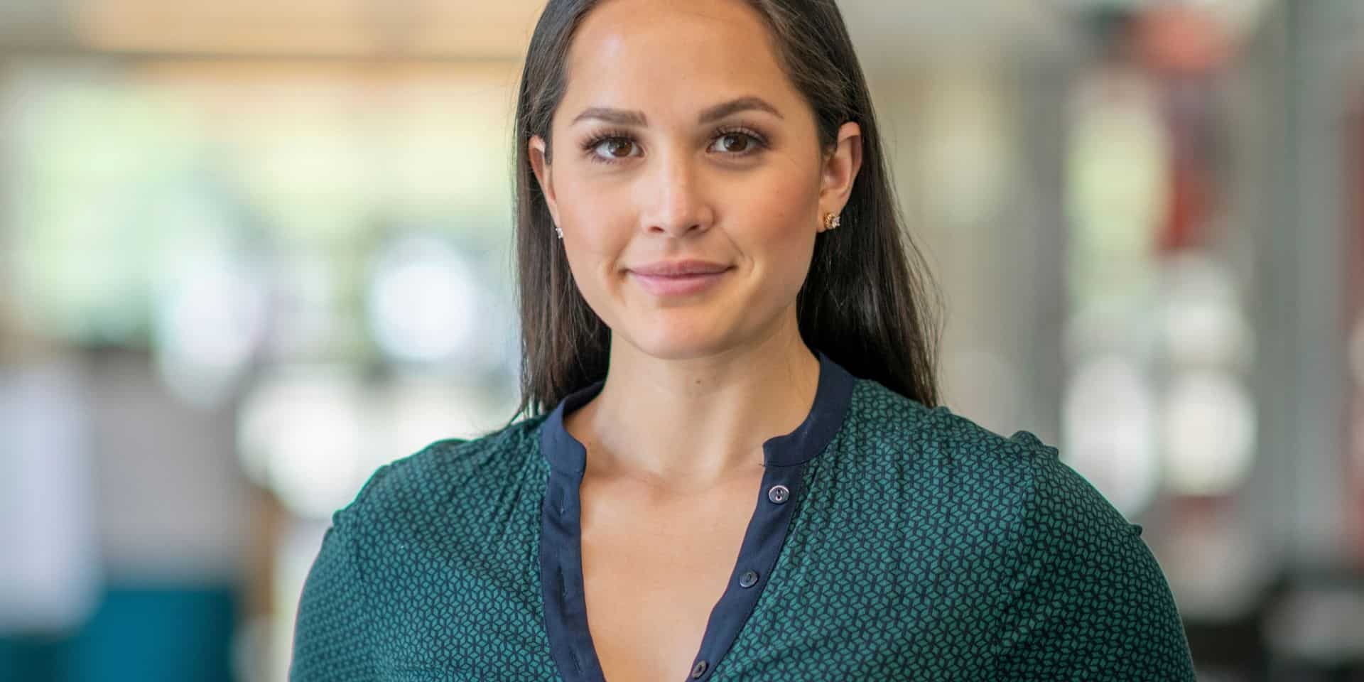 Calm, smiling woman with long dark hair